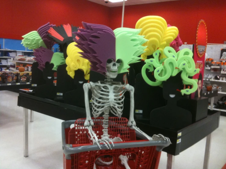 a skeleton with arms and legs, sitting inside a shop