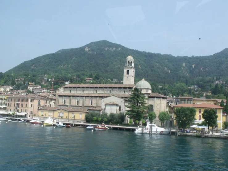 a town with water in front of it, with buildings next to the sea