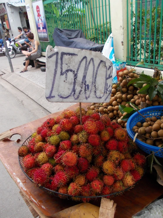 many fruit displayed in the streets for sale