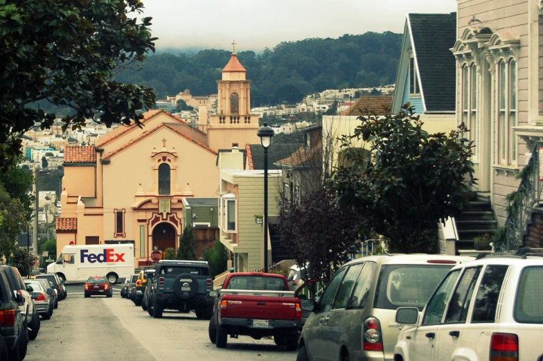 a street with cars parked on the side of the road