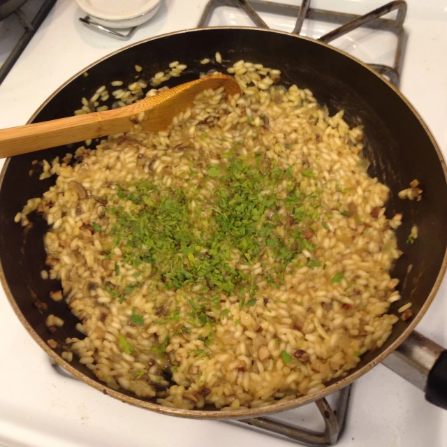 some food being cooked in a pan on a stove