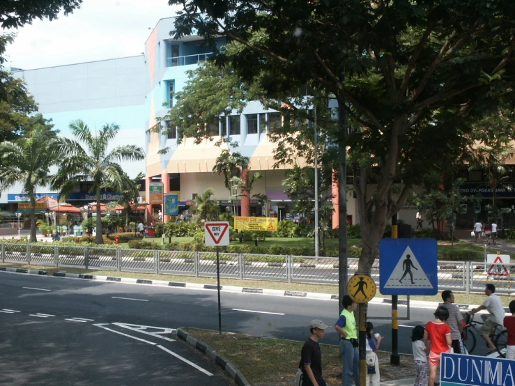 a street with a lot of people and signs