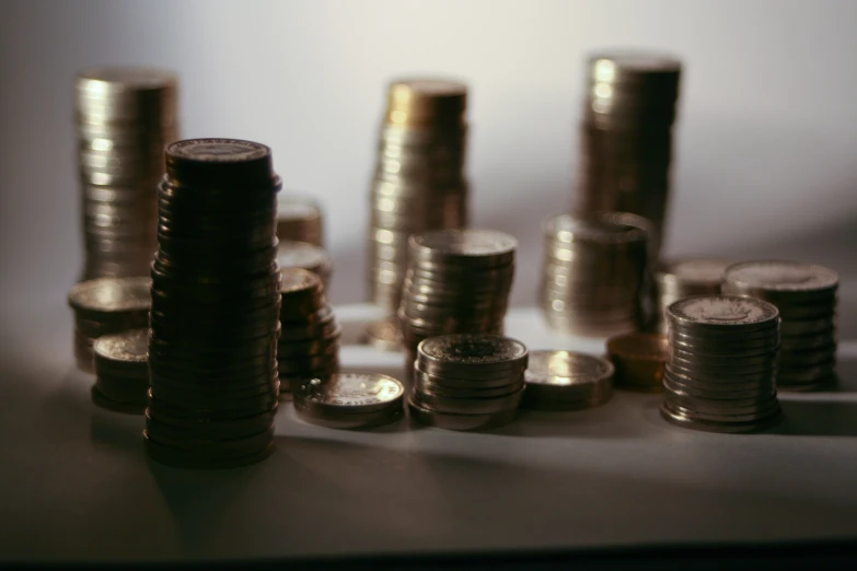 a group of gold coins sitting on top of each other