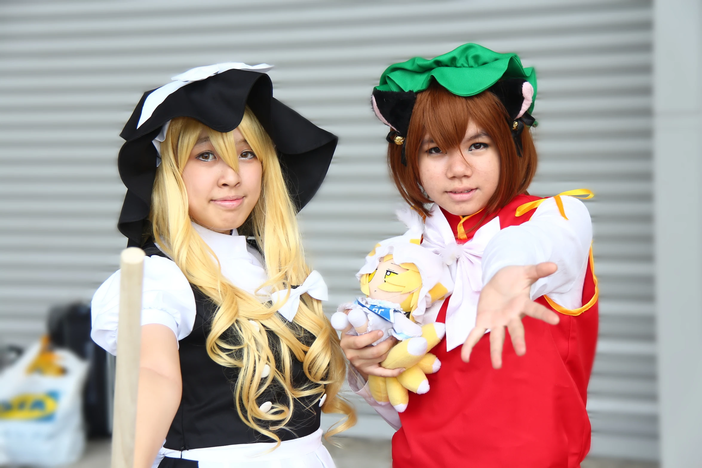 two women standing next to each other in costume