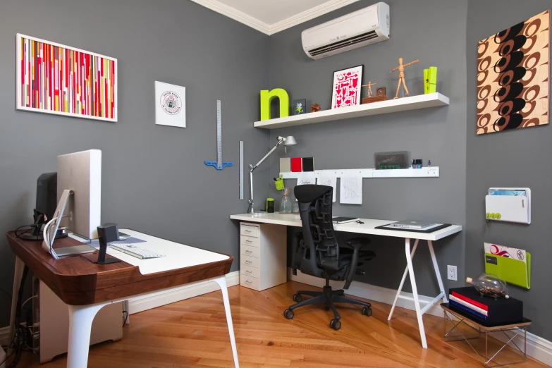 a desk with a computer sitting on top of it