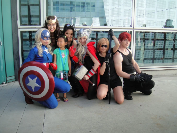 group of young people in costume poses for a po