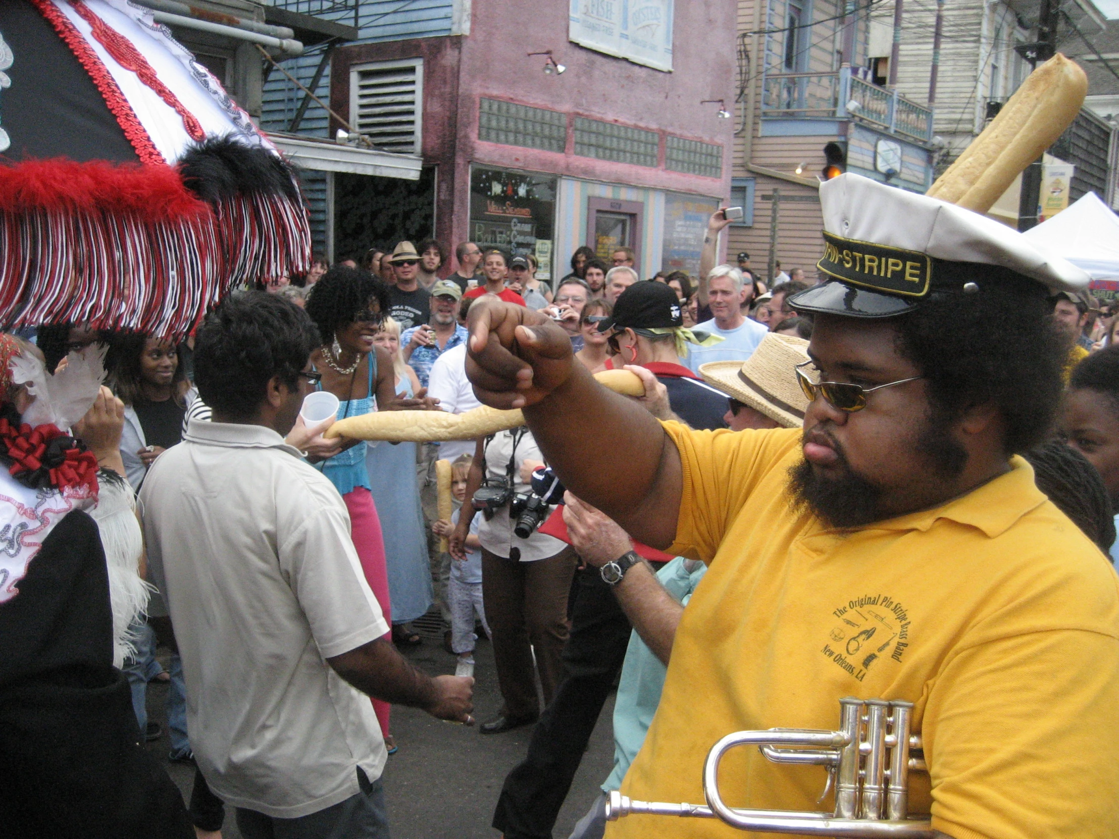 a man is holding up a bat in a crowd