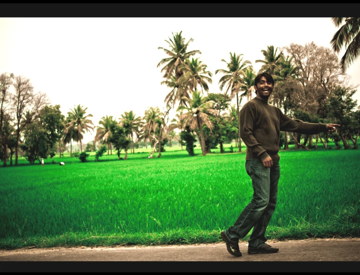 a man in a field with a frisbee