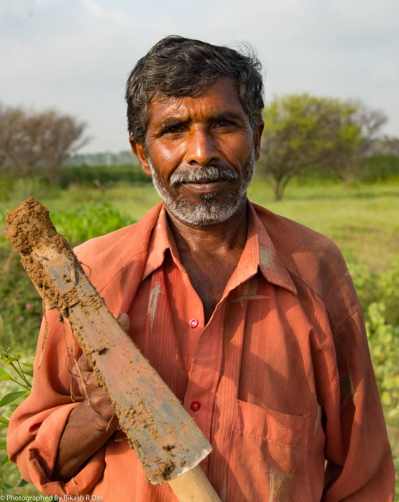 an older man with a machula in his hand