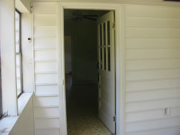 a doorway and doorway in a building with only a window