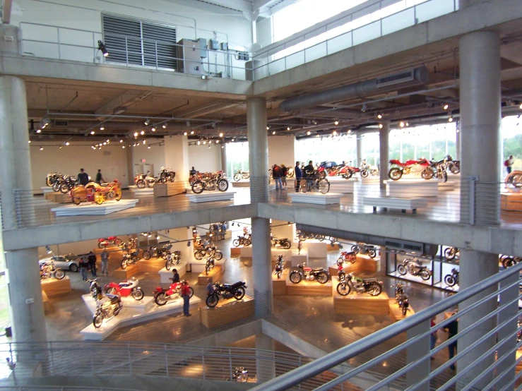 a view of several levels of a display building that is filled with motorcycles