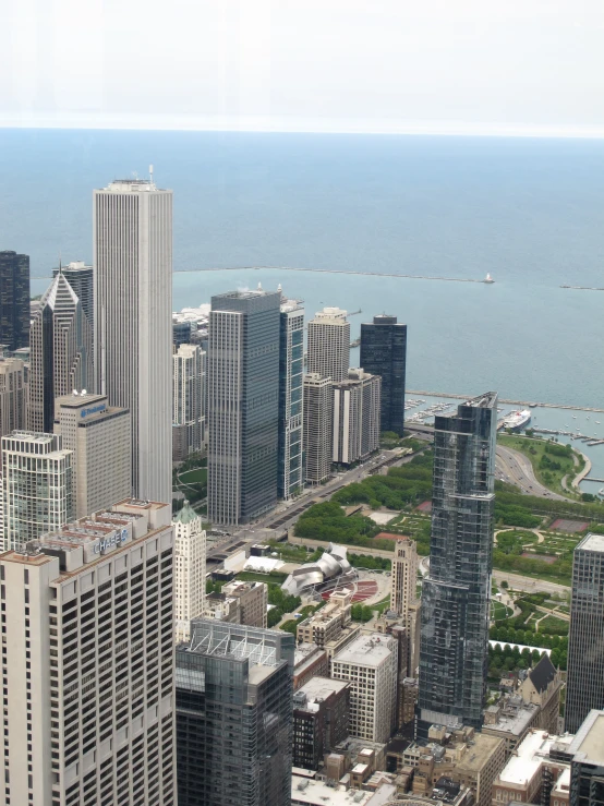 a city view looking down on the water and skyscrs