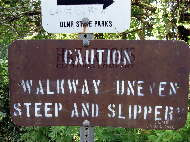 a street sign has been altered to give way