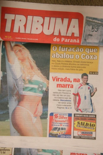 a news paper with the front page showing a woman in bikini