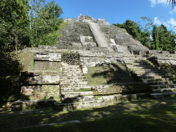 an ancient building is surrounded by trees