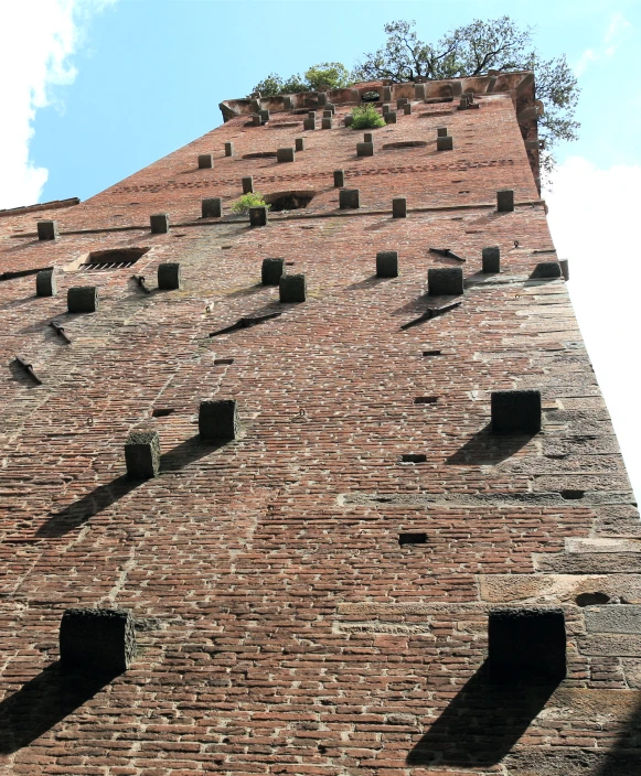 an old brick building with square window openings