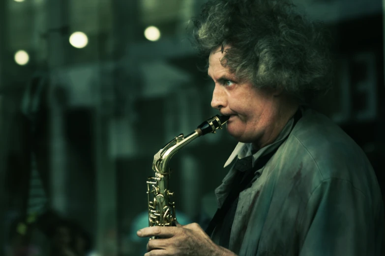 man with curly hair playing saxophone in the city