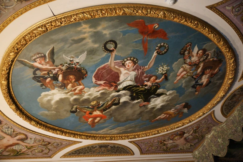 an elaborate ceiling painting is shown in this building