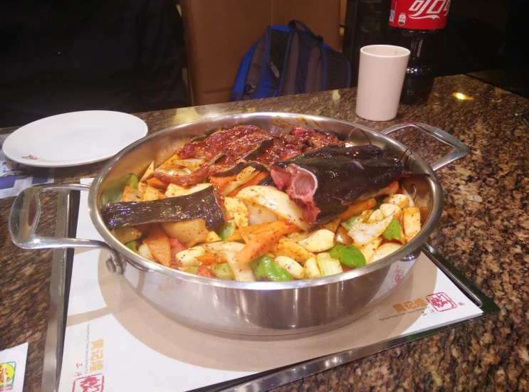 a big pot full of food with some other ingredients