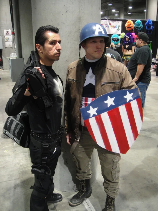 two men dressed up in costume and with a shield