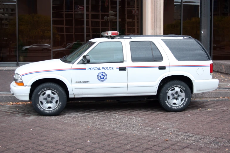 a police car parked in front of a building