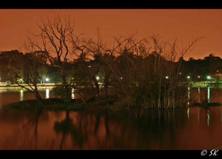 a lake at night with water reflecting lights