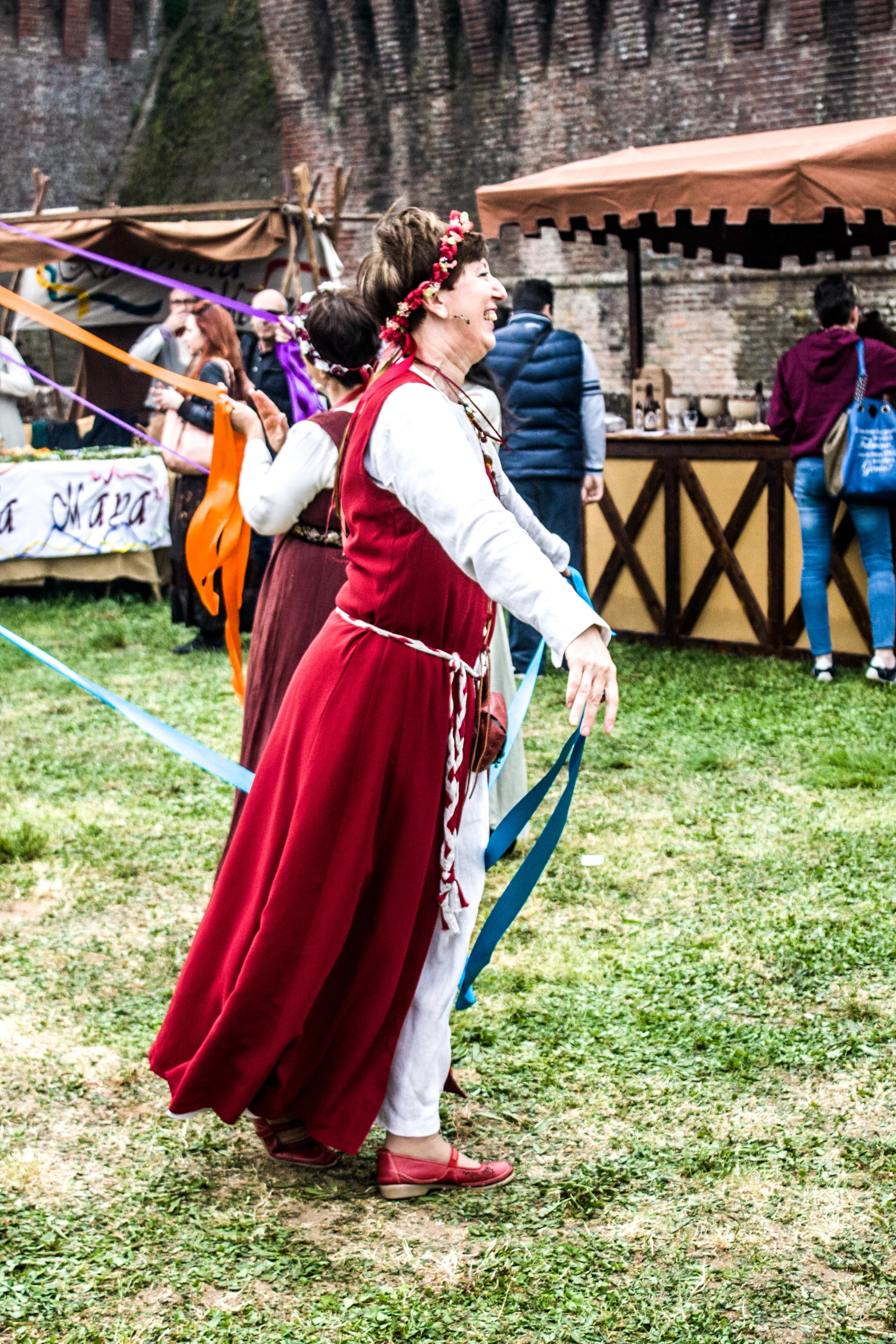 a girl in a long dress holding a sword