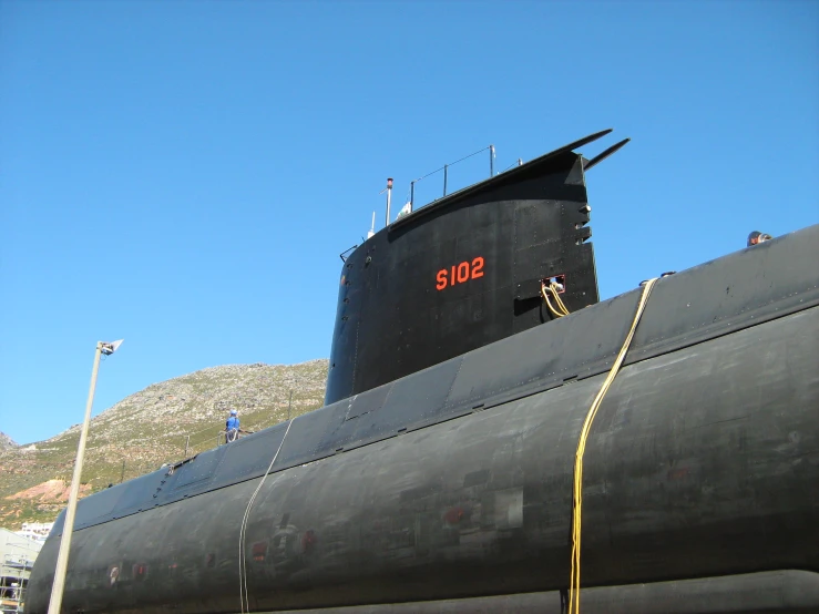 a sub type submarine on a body of water