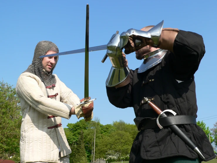 two knights dressed in full costume standing together