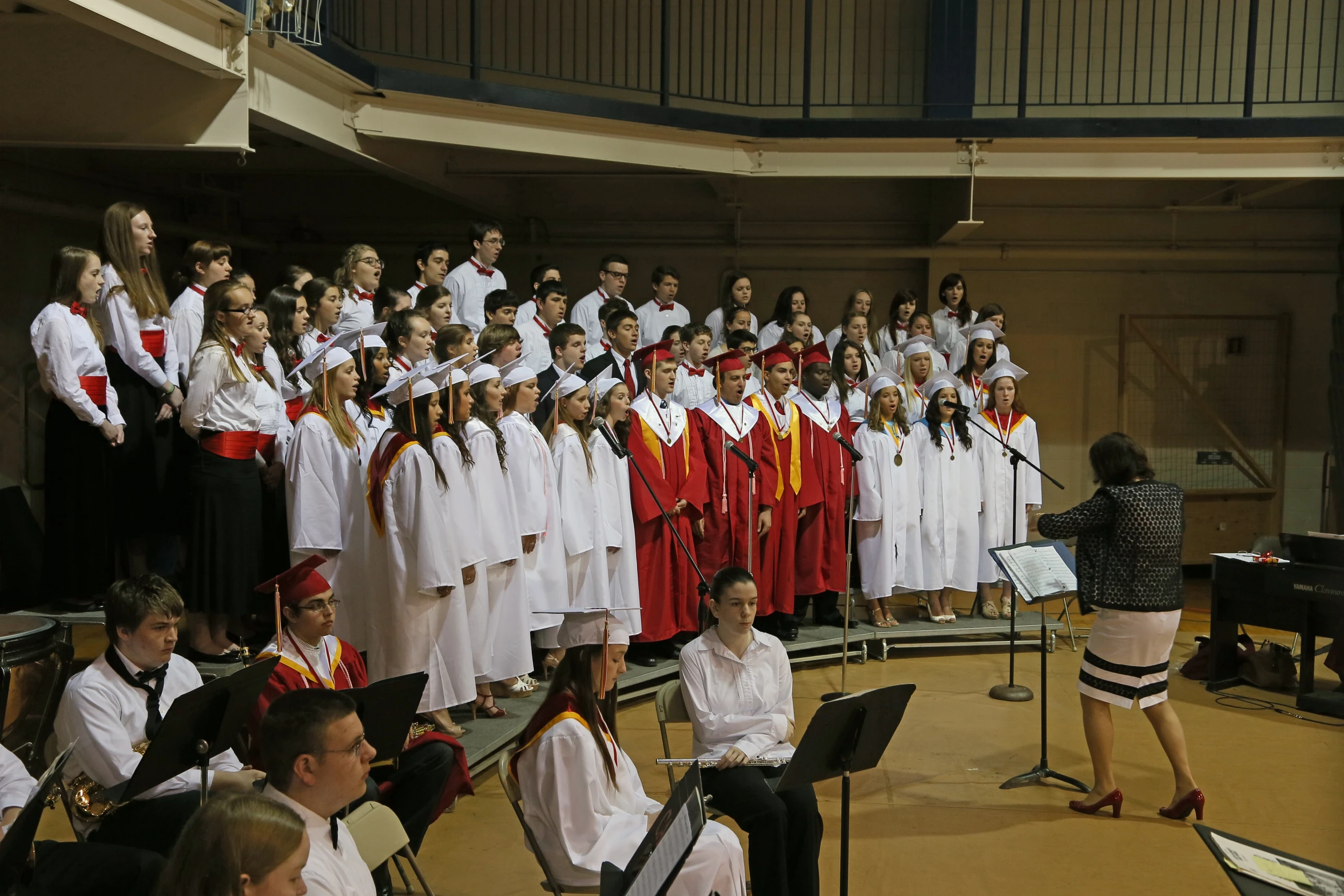 an audience looks on as some people in choir sing and sing