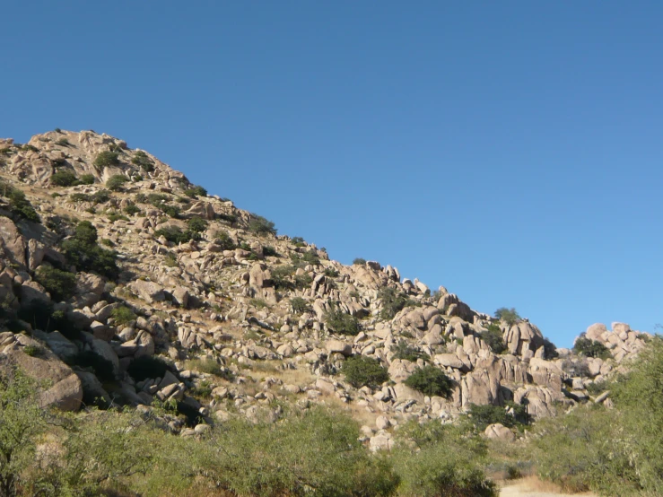 a view of the top of a rocky cliff