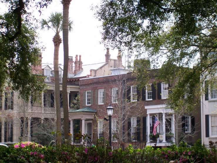 a large brick building in front of lots of windows