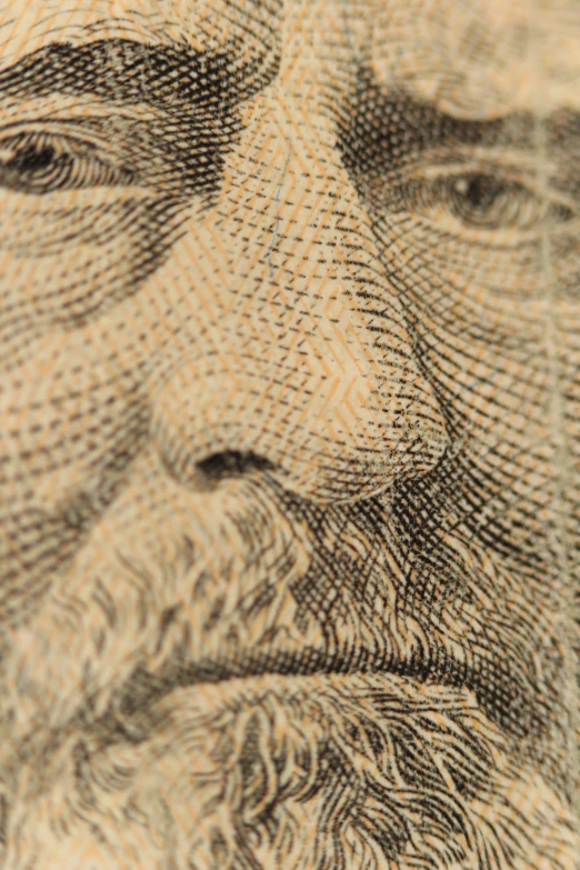 the front of a large bill, featuring an old man's face