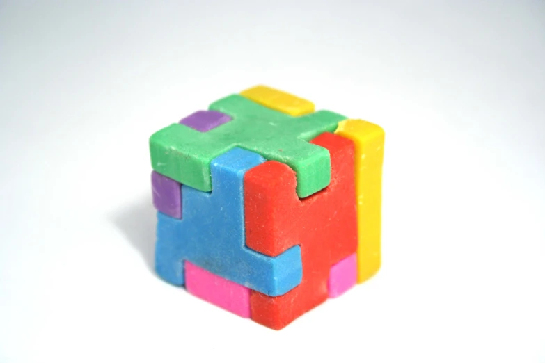 a toy cube with four smaller squares around it