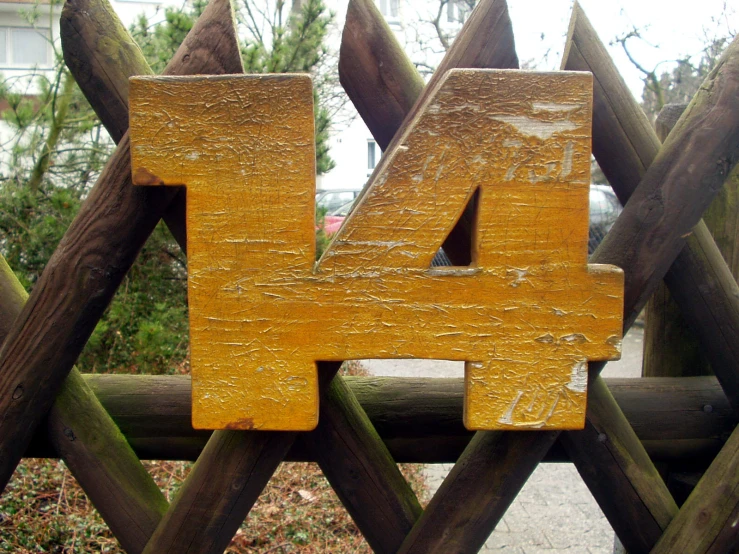 a piece of wood with the number 4 on it