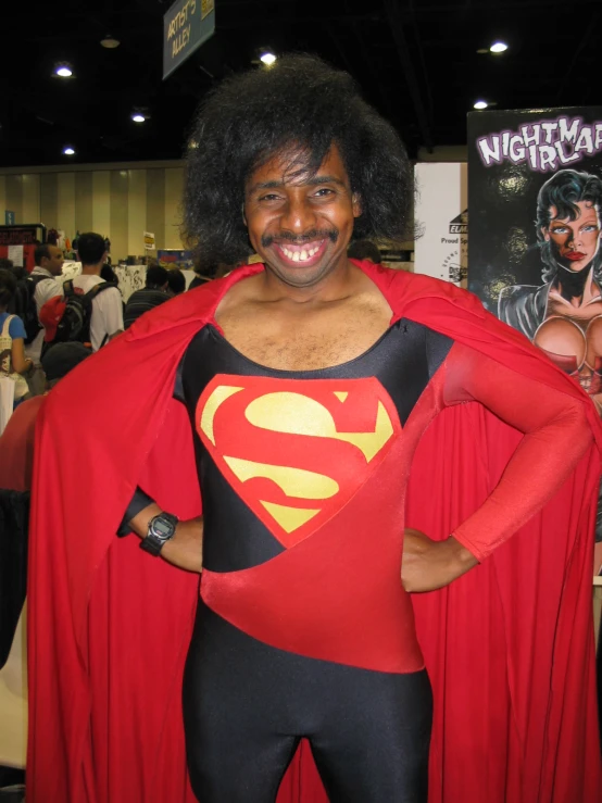 a woman dressed as the supergirl poses for a picture