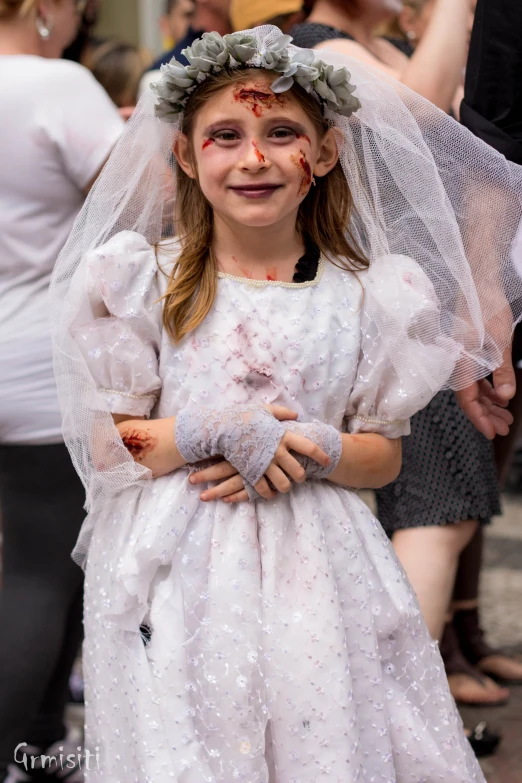 a  in her wedding dress with red and orange on her face