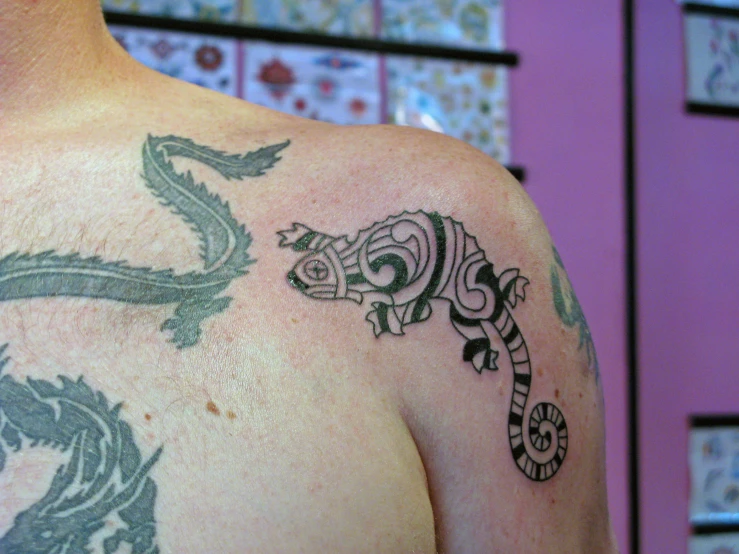 a close up of a person with tattoos on