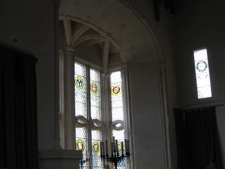 a stained glass window in a room with some stained glass