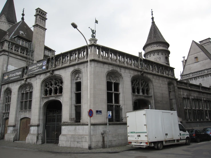 an old building with tall gothic type towers