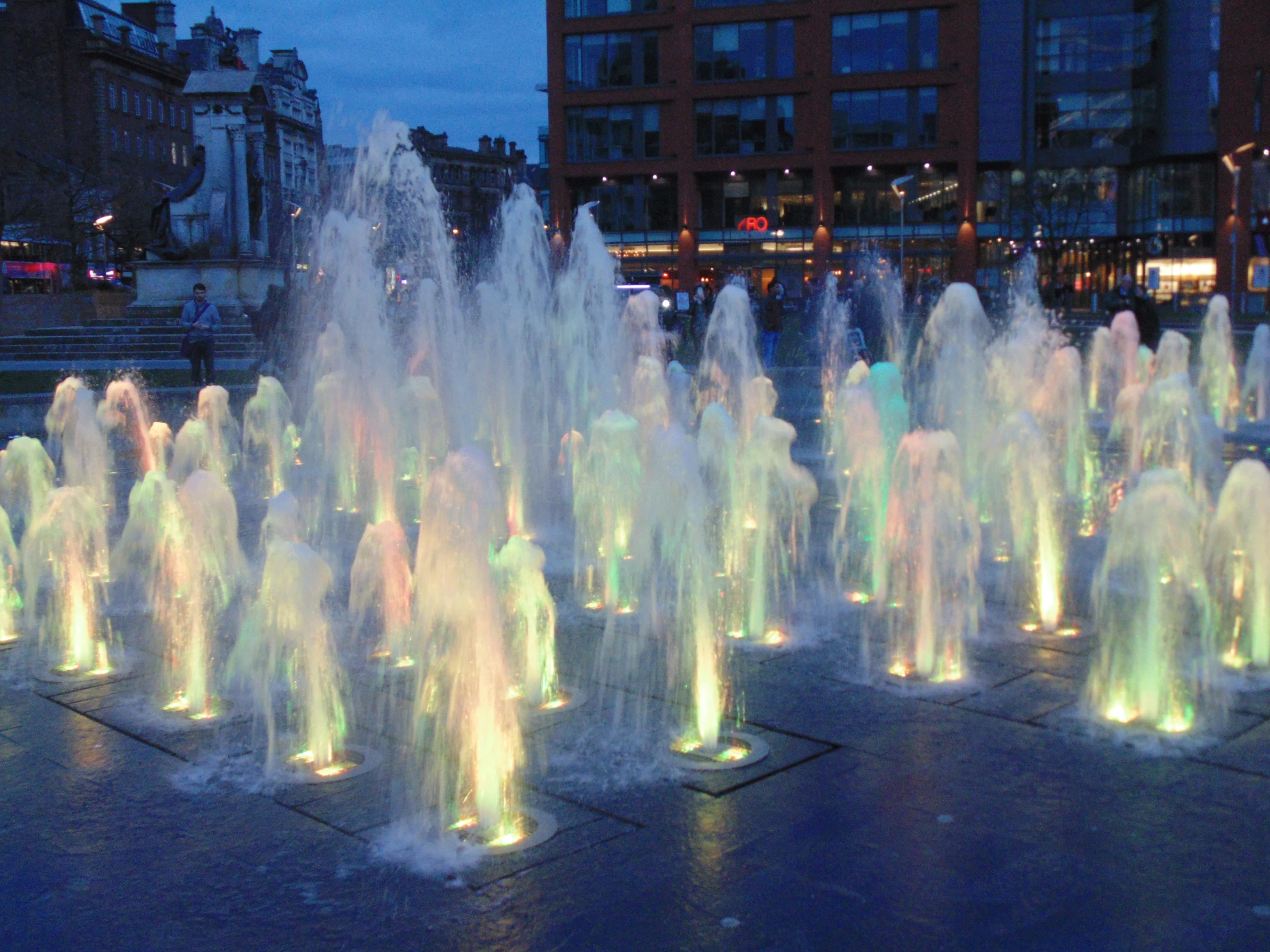 a number of water jets with different colored lights