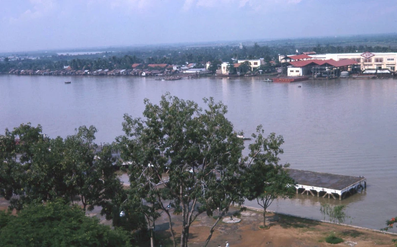 a large body of water with several houses on the other side