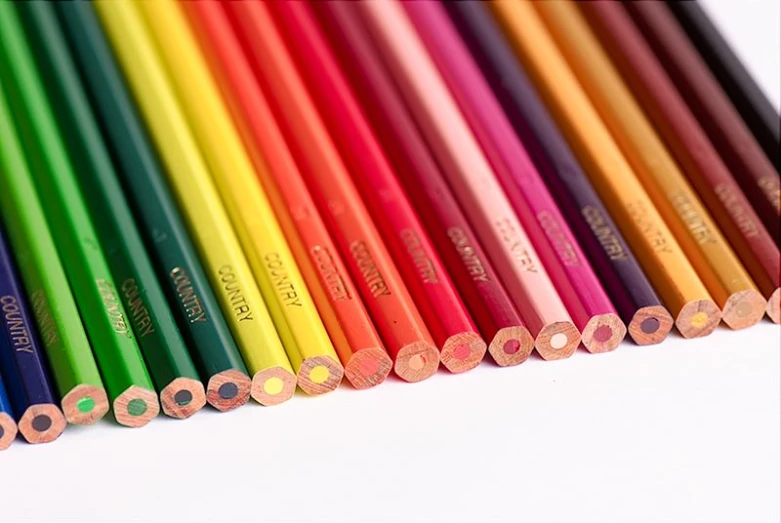 several colored pencils are next to each other