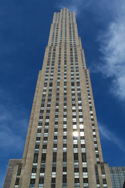 a large tall building with windows on top of it