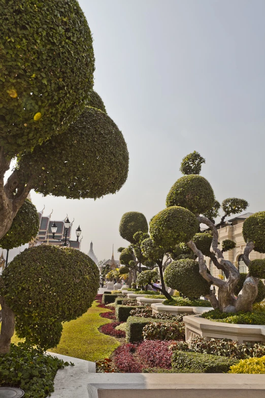 a sculpture of a group of topiary bushes in a garden