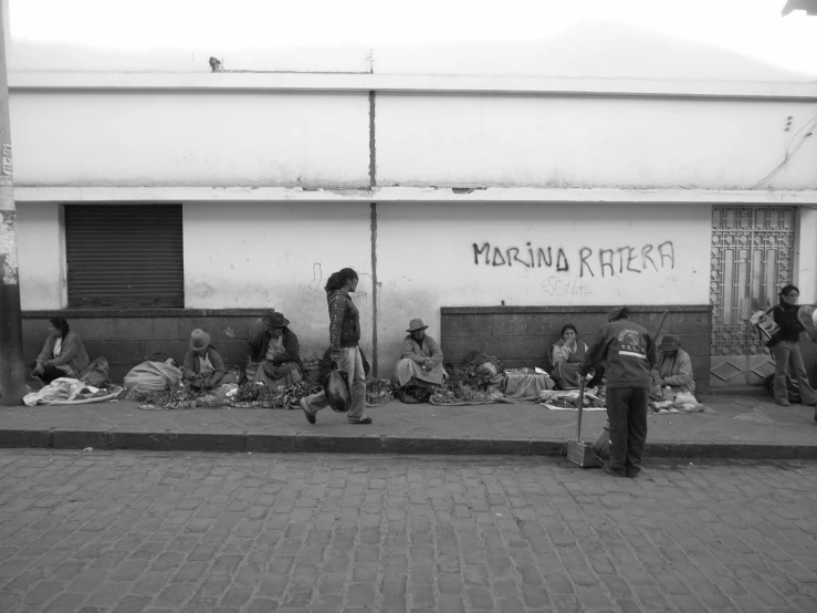 a group of people on a street with a dog