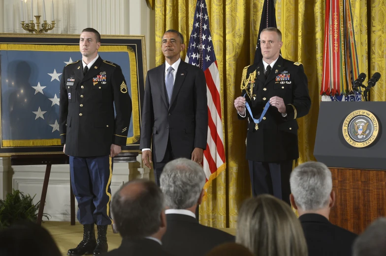 a group of men standing around a podium