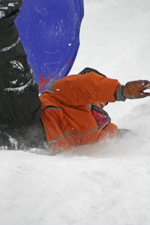 a person riding skis down a snow covered slope