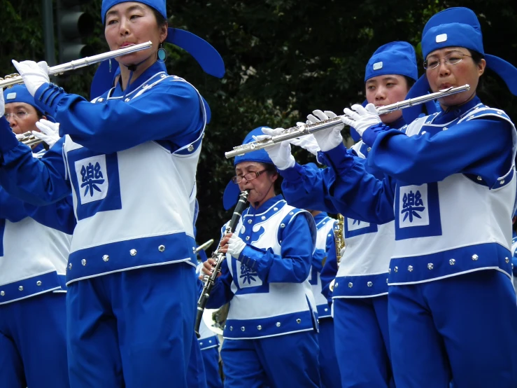 a band that is holding musical instruments standing up