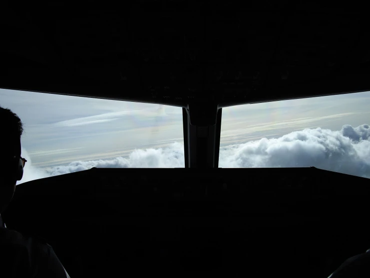 an airplane's view out the back windows of the cockpit